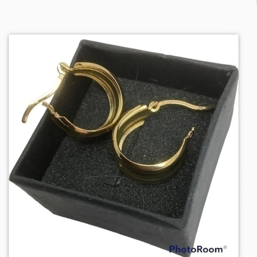 - Gold over sterling silver huggie earrings